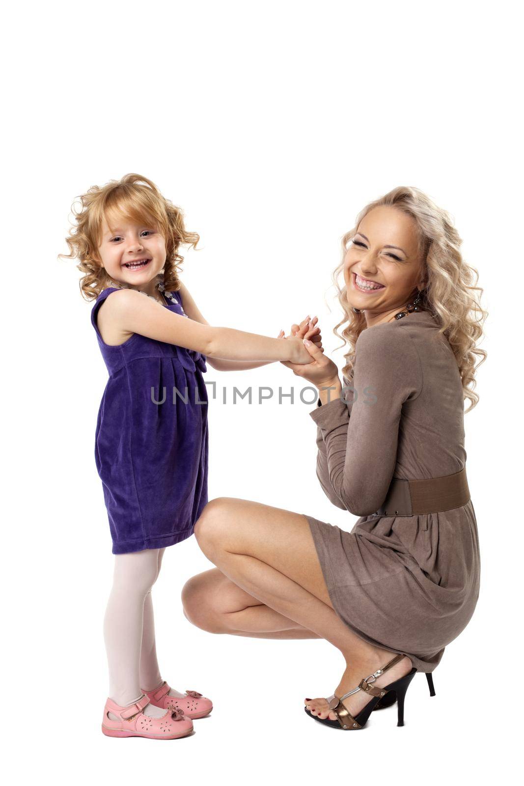 Happy mom and her daughter take hands smile isolated