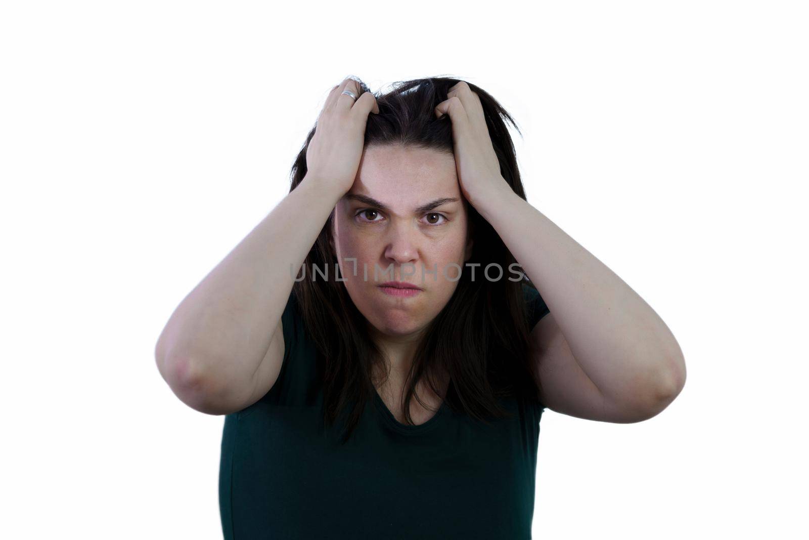 young brunette long haired girl pulling her hair angrily isolated on white background
