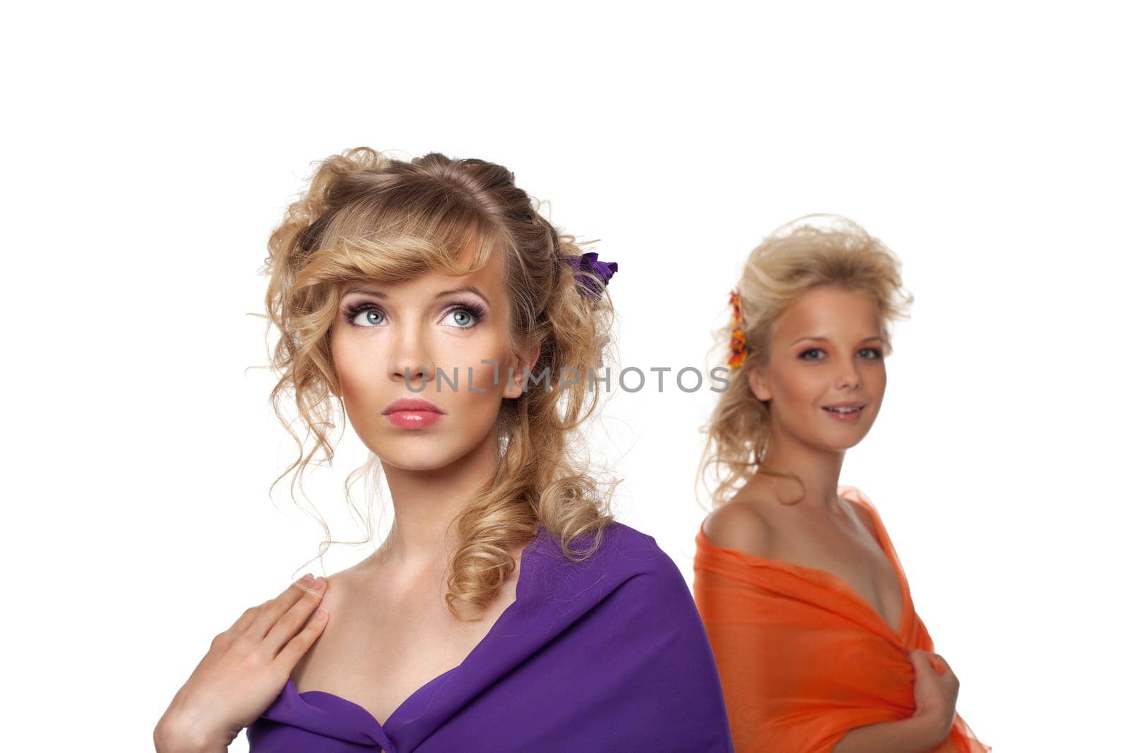 two pretty young woman with flowers in hairs- color veil