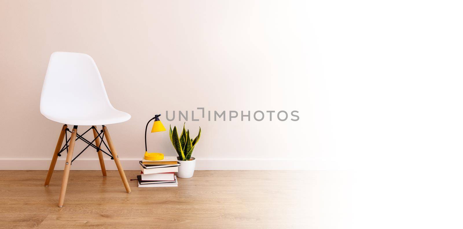 banner with copy paste, white background. Empty chair next to books, alarm clock and home plant by Ramanouskaya