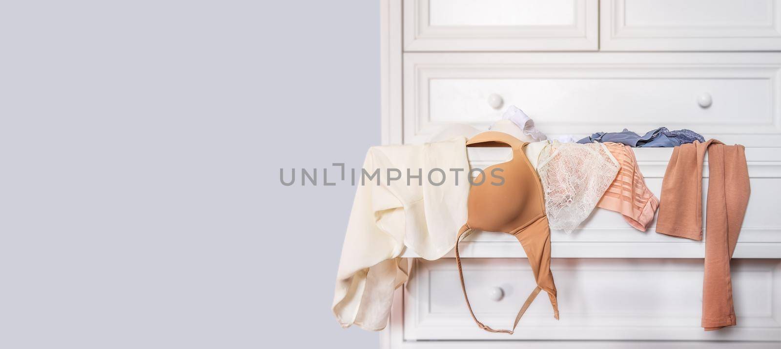 banner with women's underwear close-up on a white background by Ramanouskaya