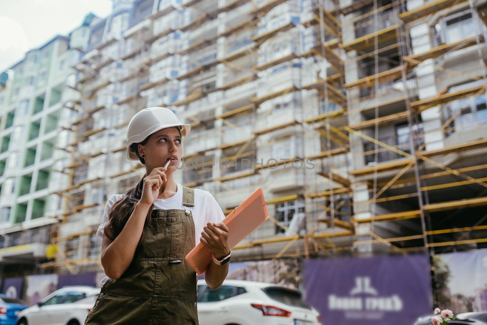 Woman construction engineer wear safety white hard hat at construction site industry worker. Woman construction Engineer concept