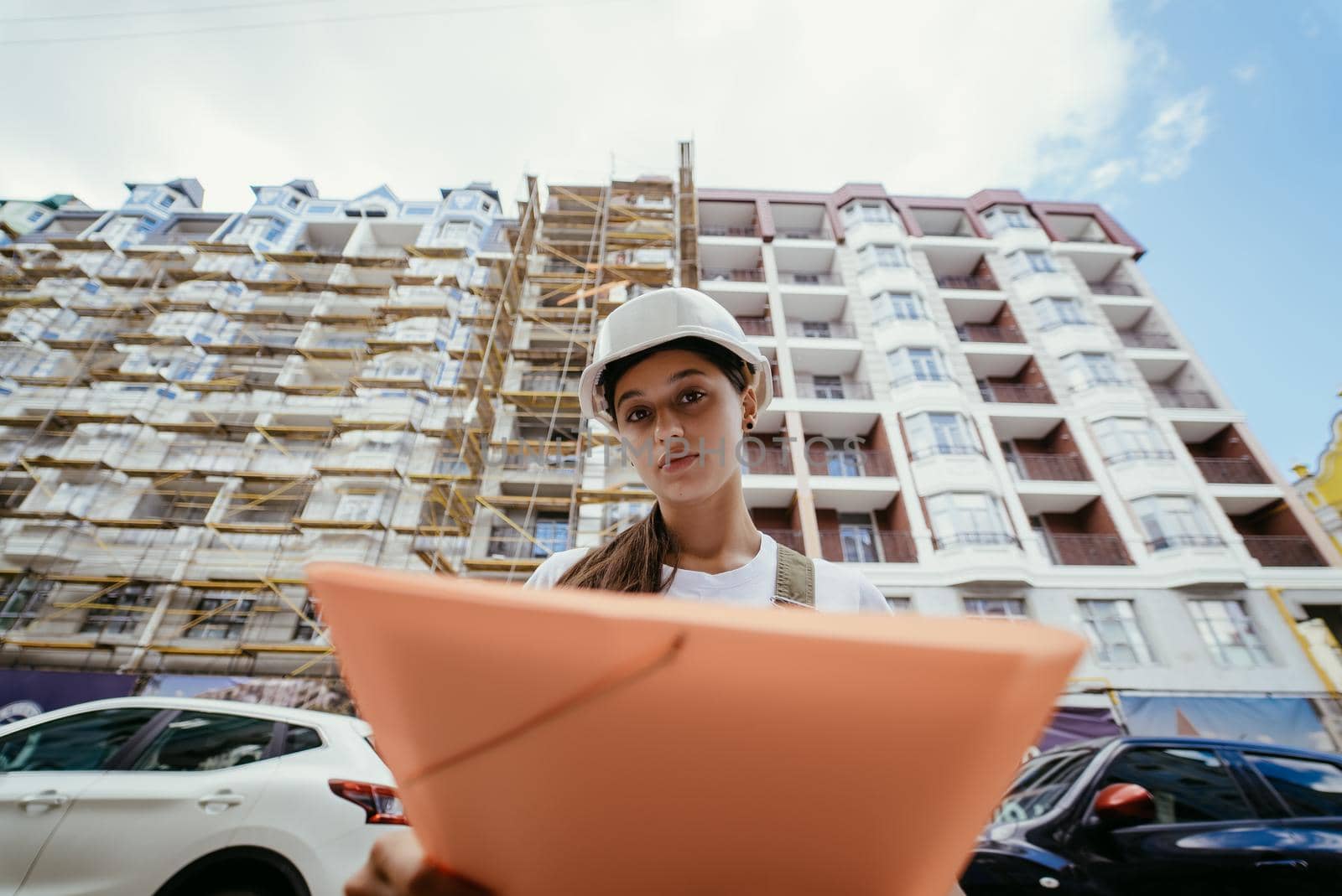 Woman construction engineer wear safety white hard hat at construction site. Woman construction Engineer concept