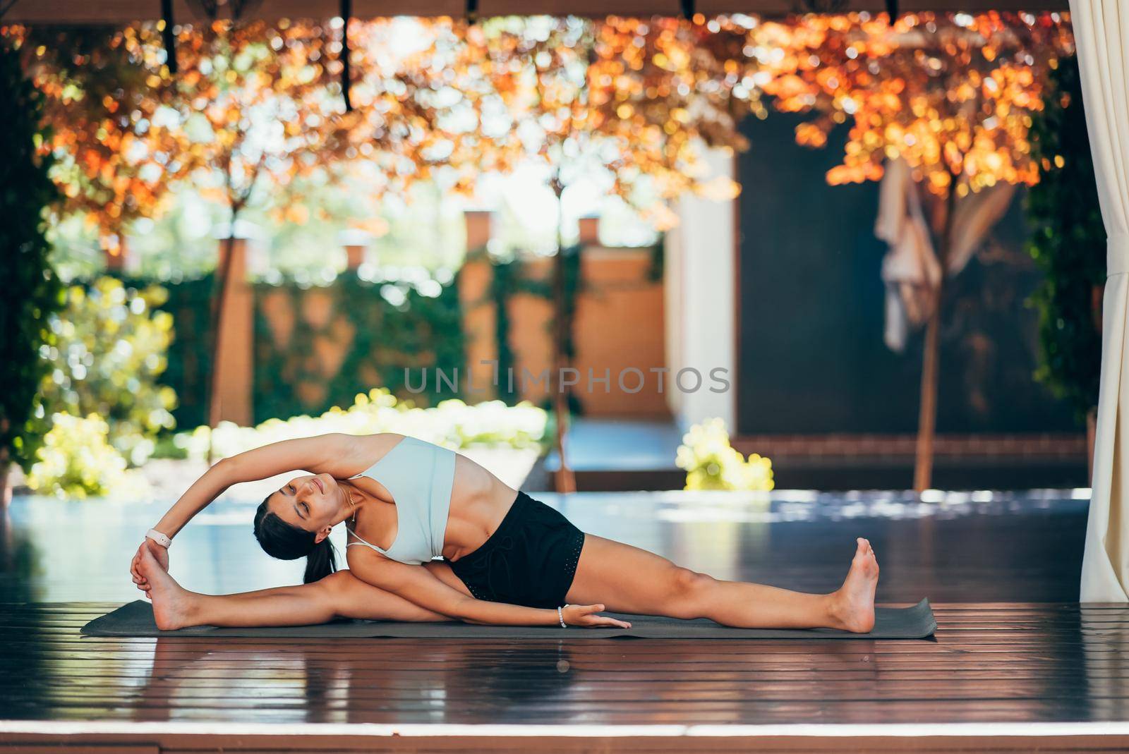 Young woman practicing yoga alone