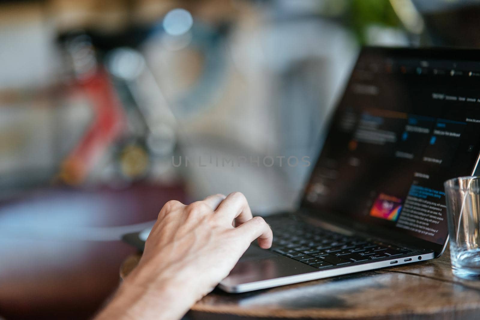 Woman working at home office hand on keyboard close up