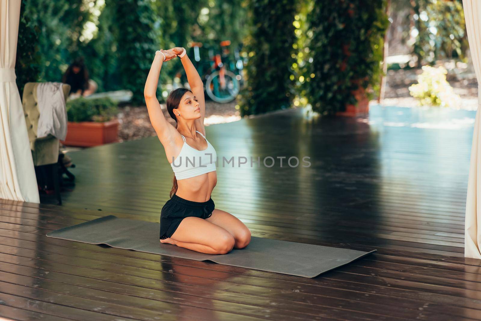 Young woman practicing yoga alone
