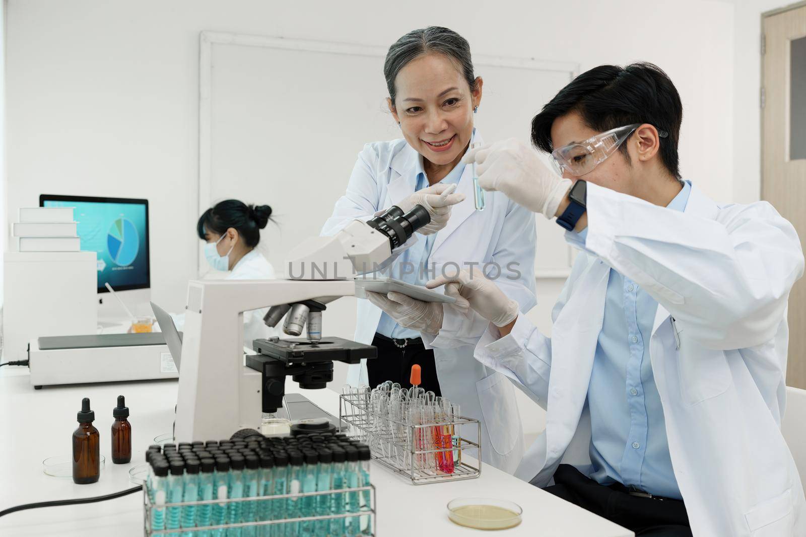 Scientist holding a test tube containing cannabis extract.