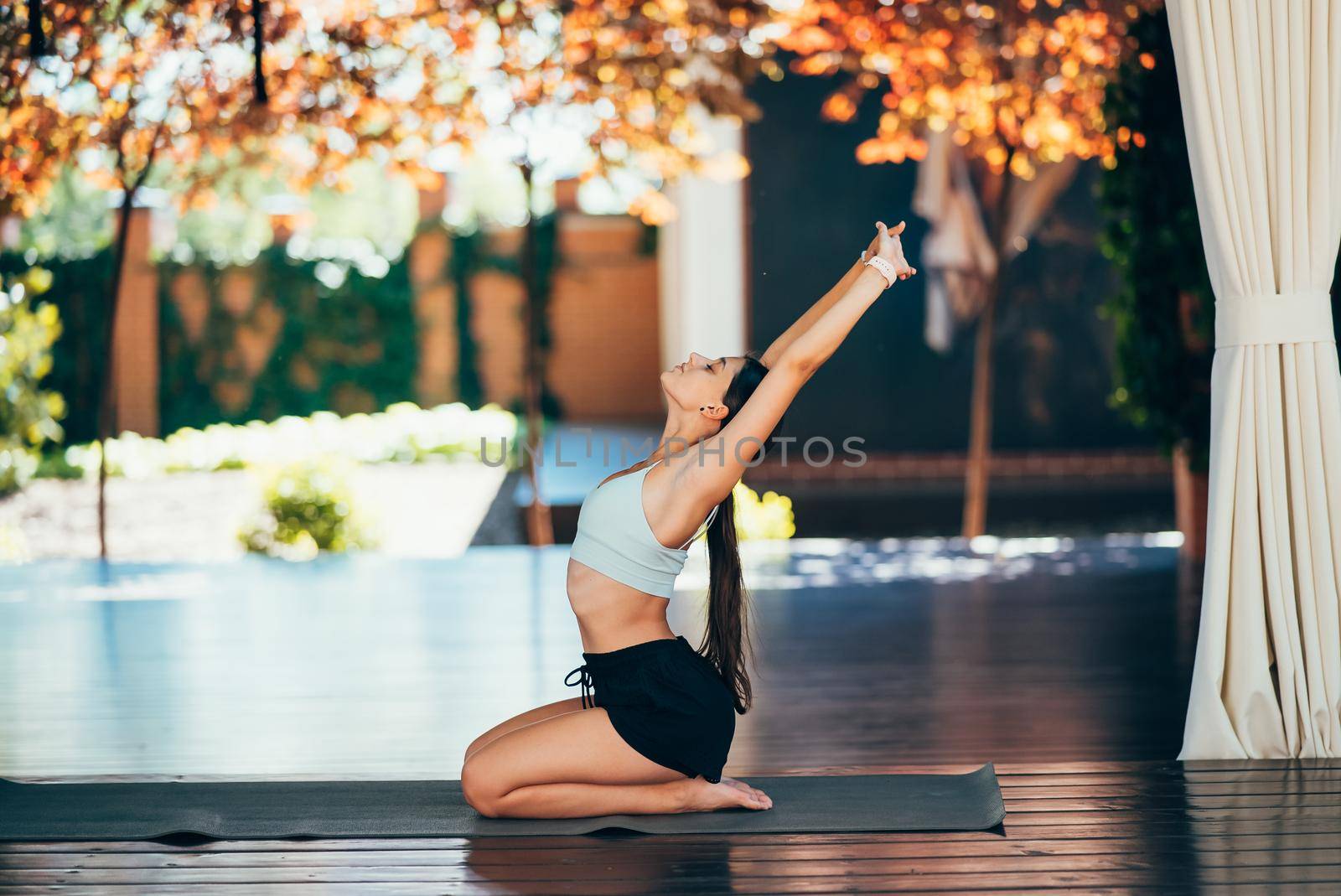 Young woman practicing yoga alone