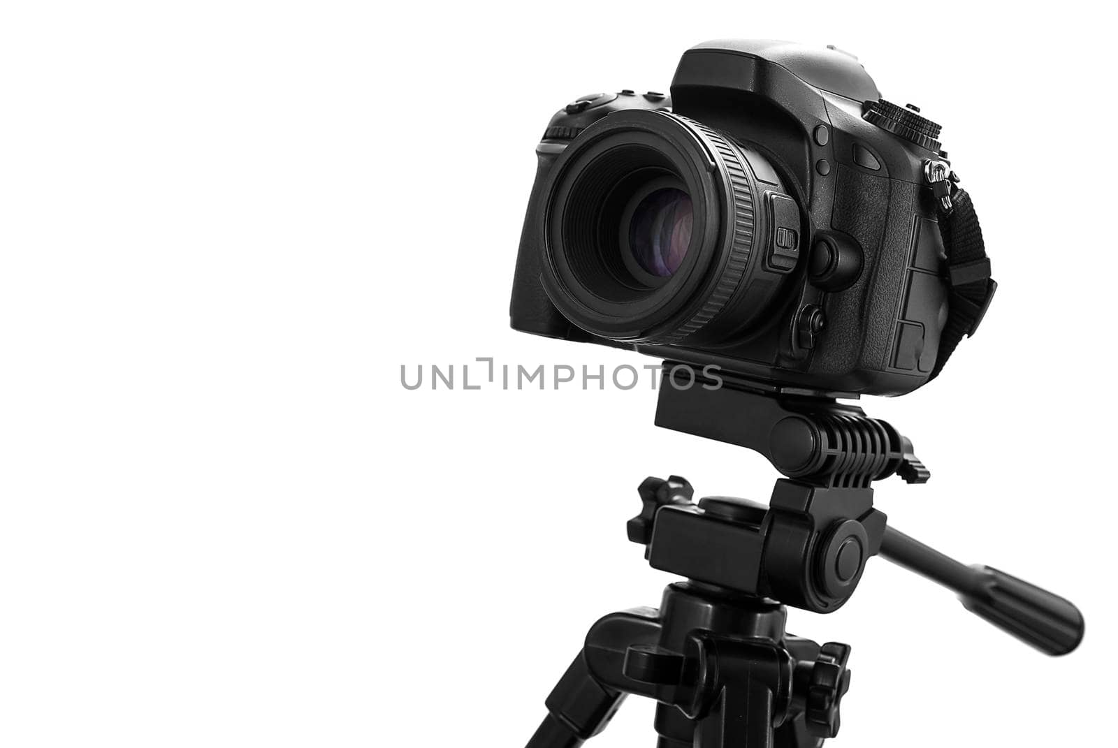 Photo camera on tripod isolated at white background