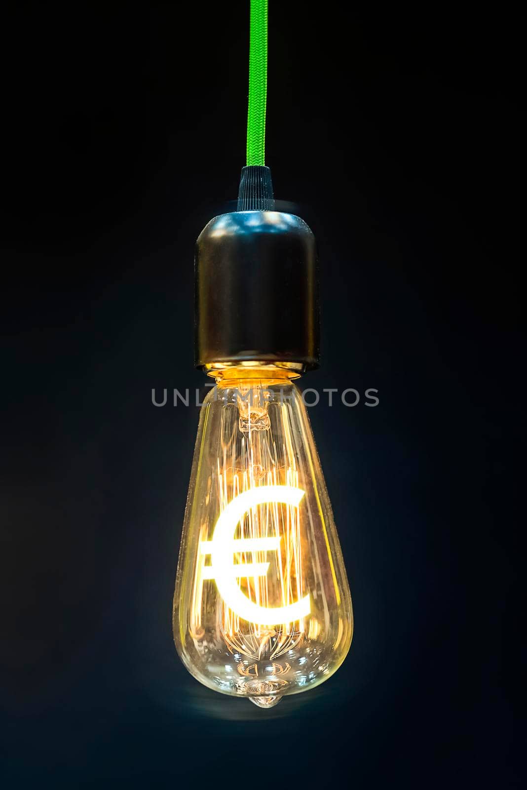 Money making idea. Light bulb with Euro symbol.