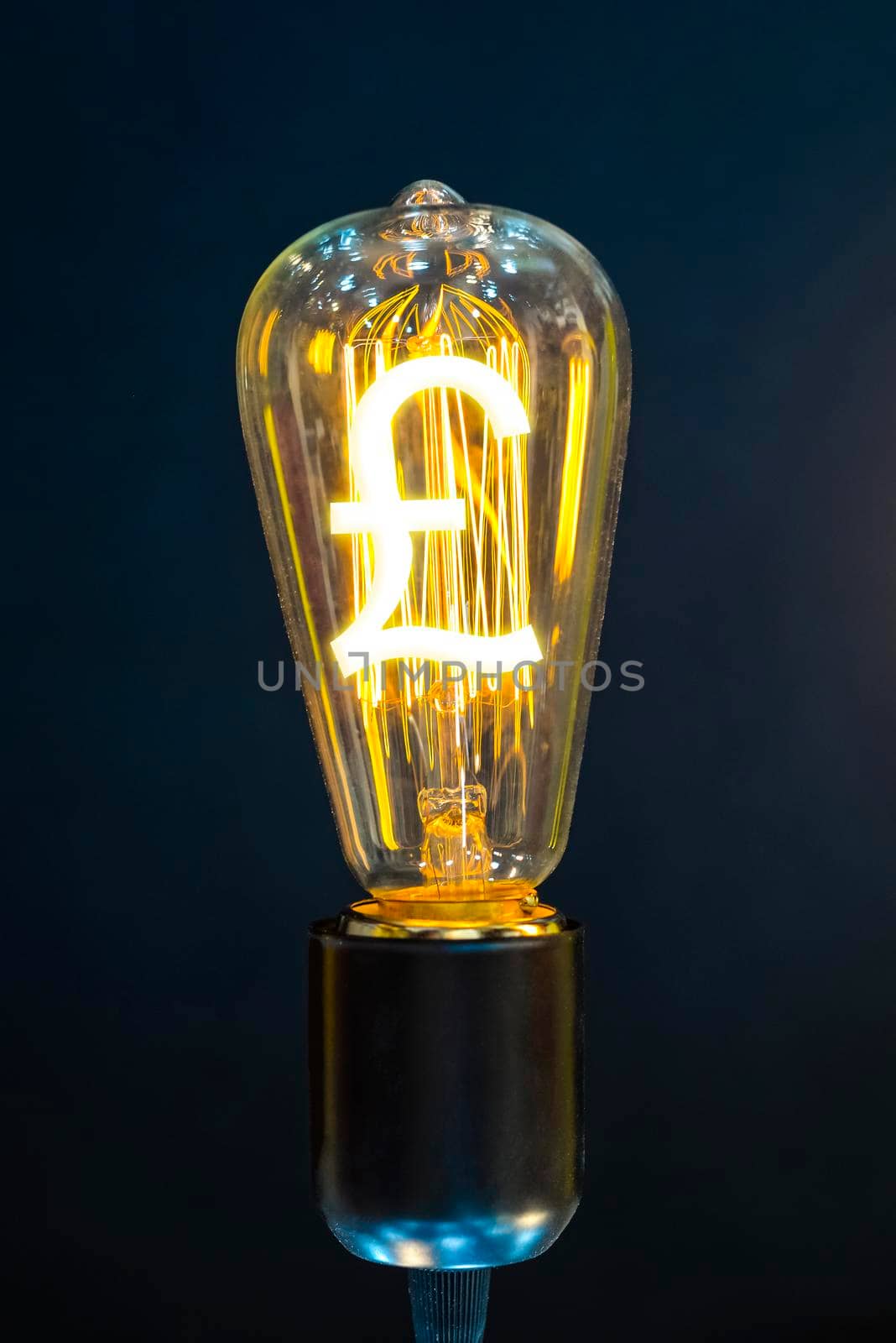 Money making idea. Light bulb with Pound sterling  symbol.