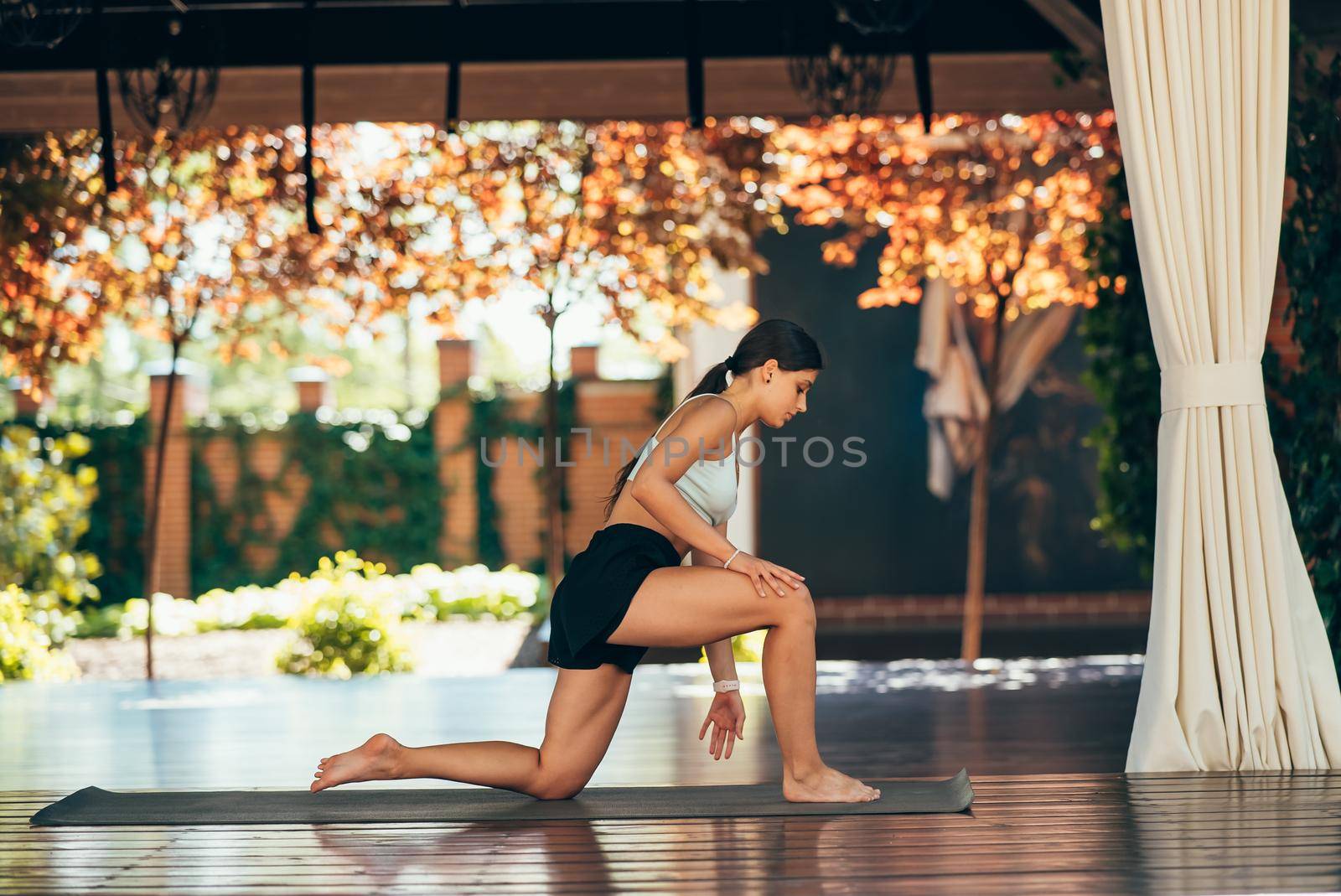 Young woman practicing yoga alone