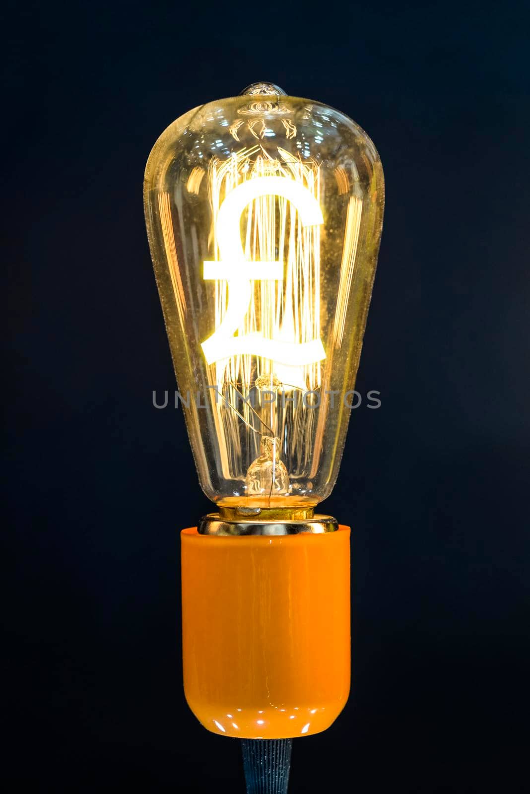 Money making idea. Light bulb with Pound sterling  symbol.