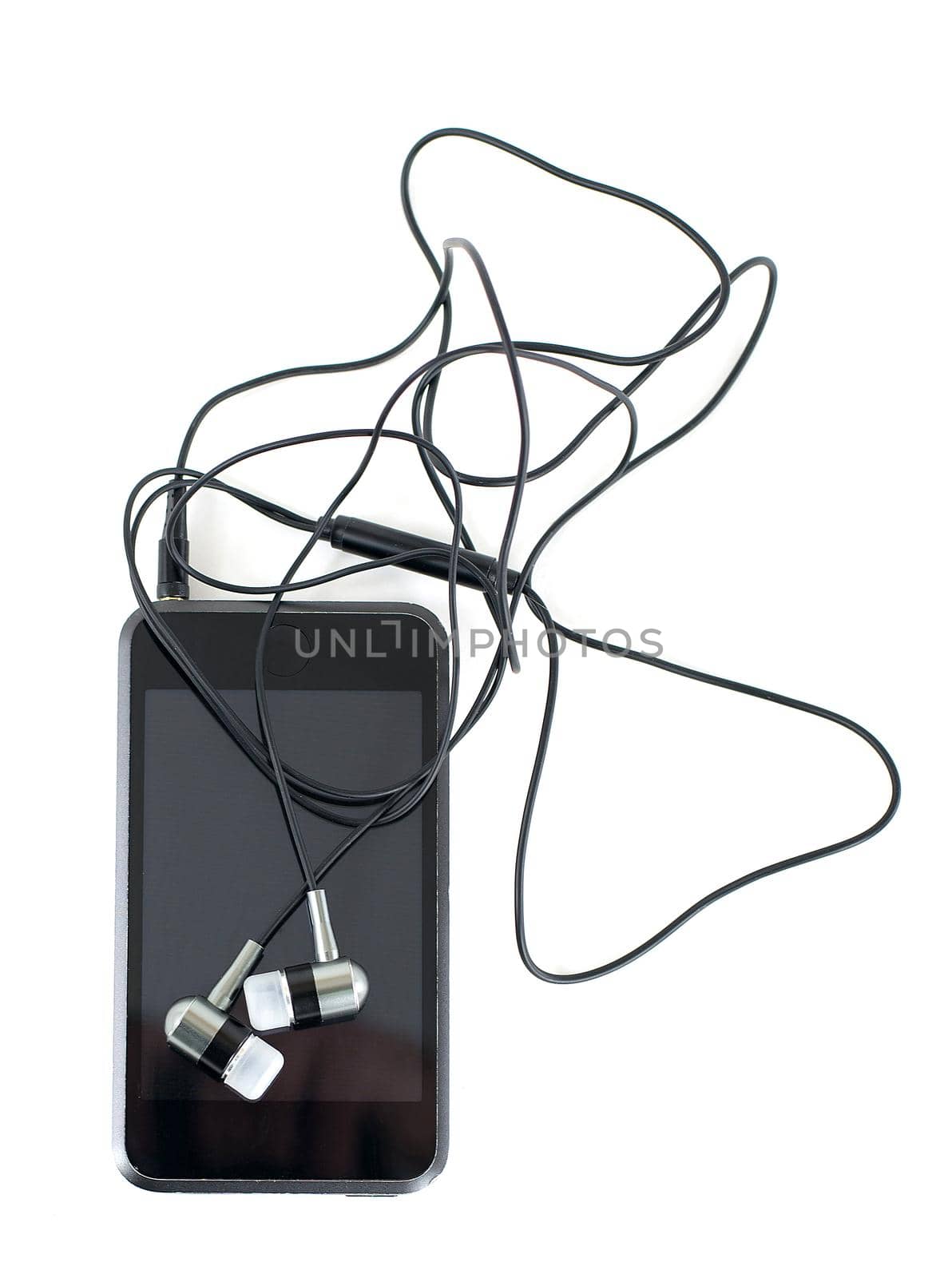 Headphones and media player on a white background. Close up.