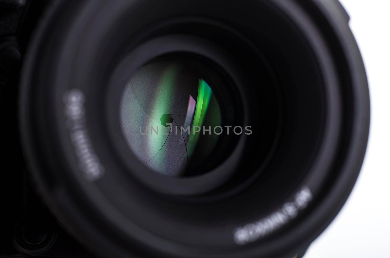 Camera lens close-up on white background