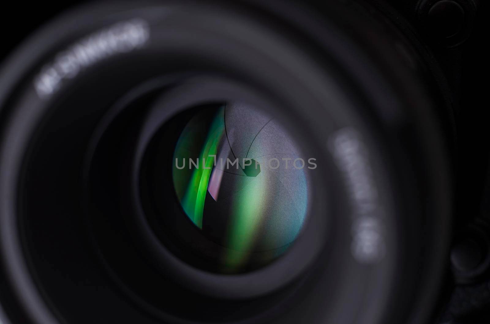 Camera lens close-up on white background