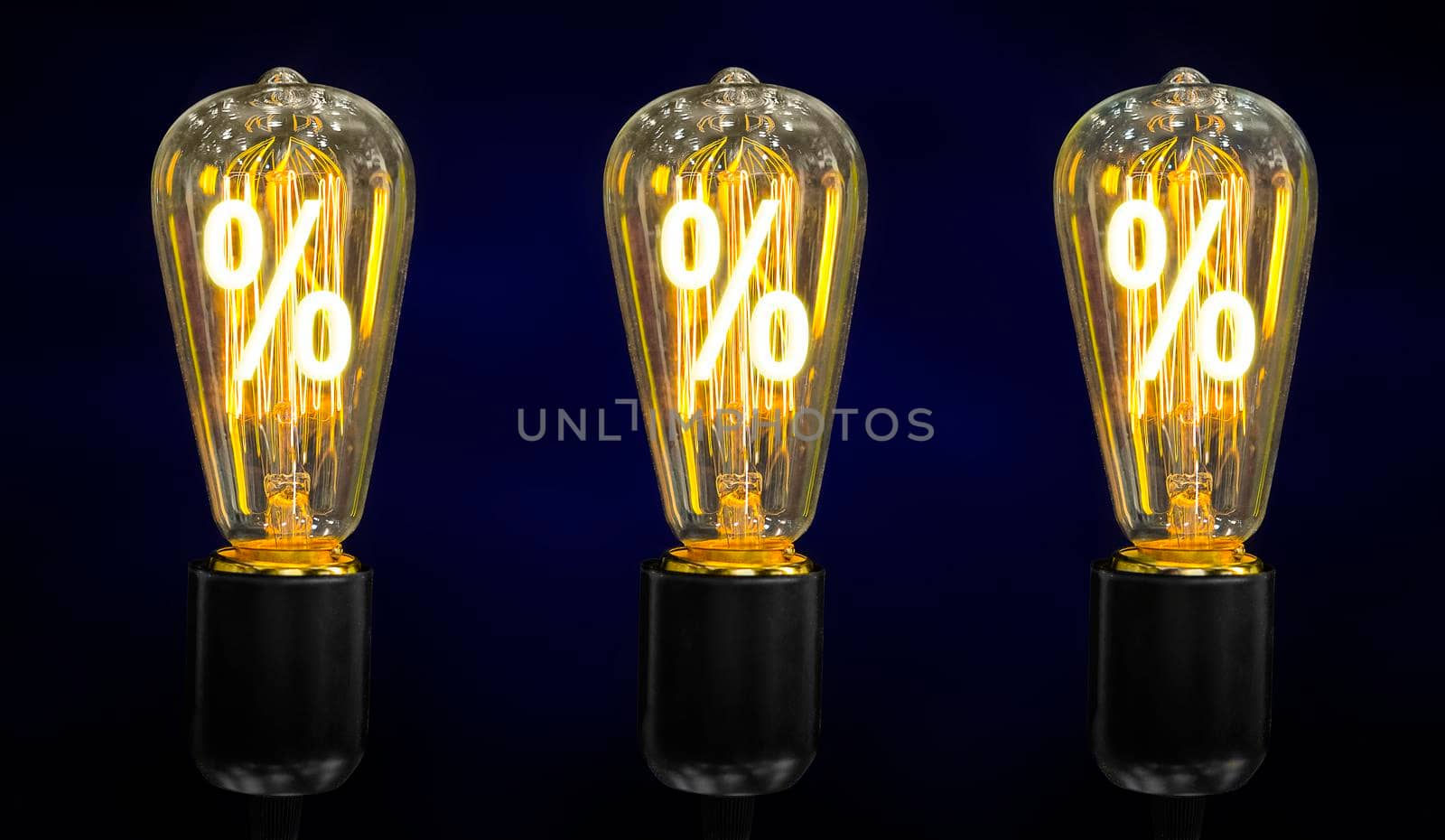 Bulb with glowing percent mark inside of it, creativity concept