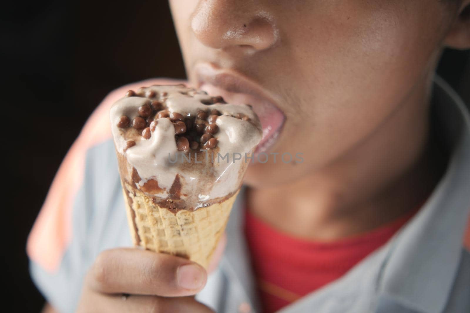 young men eating vanila flavor ice cream ,