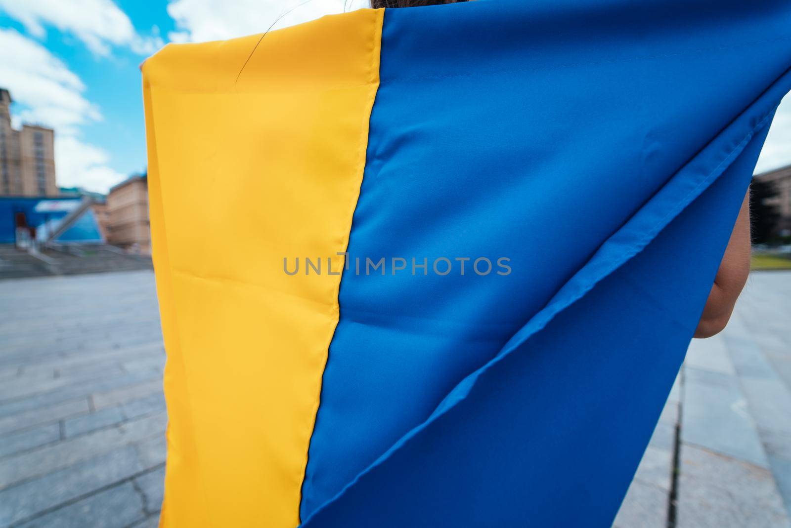 Fabric curved flag of Ukraine, UA. Blue and yellow colors.