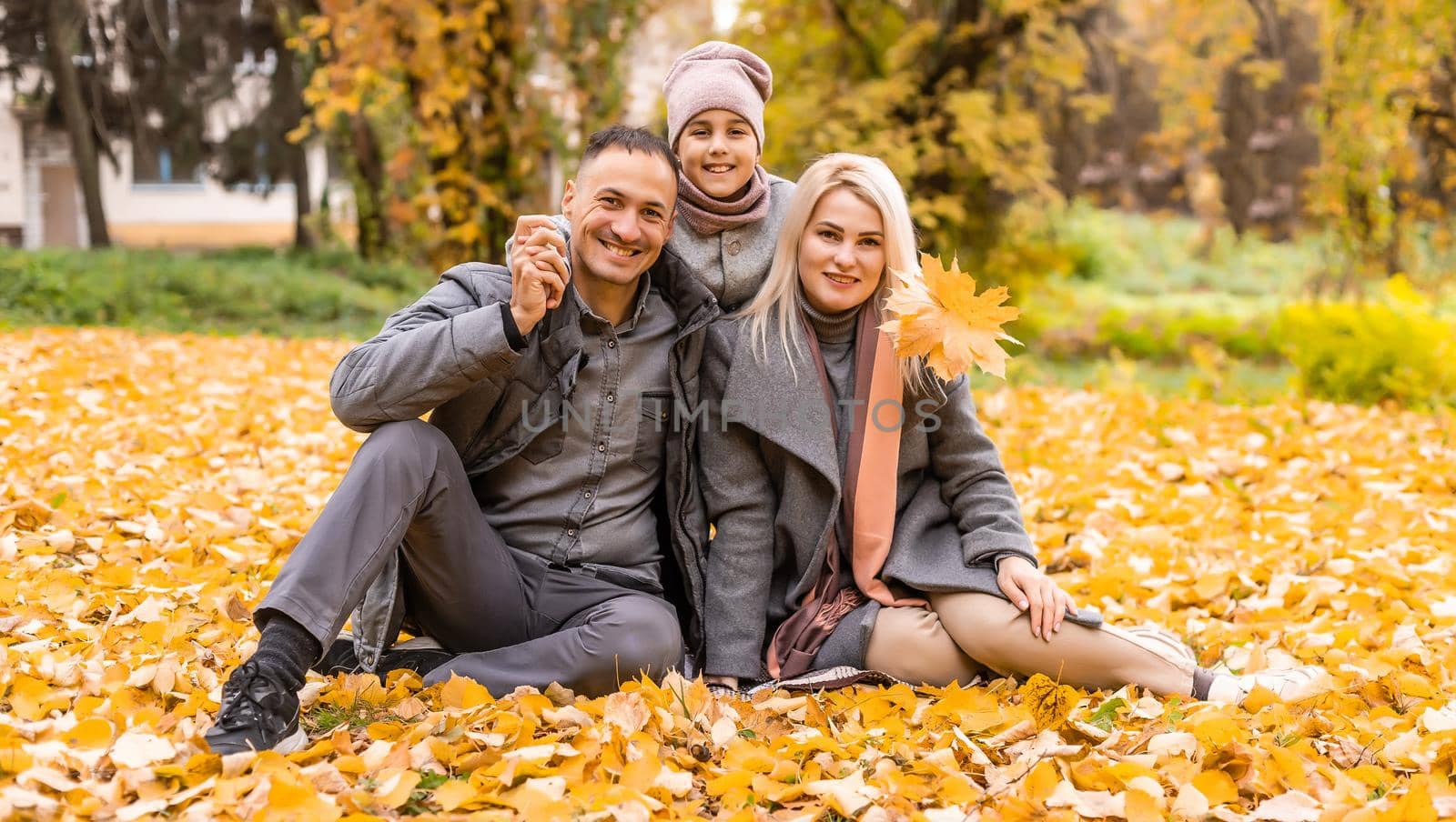 The family walks in the autumn forest and enjoys the autumn colors by Andelov13