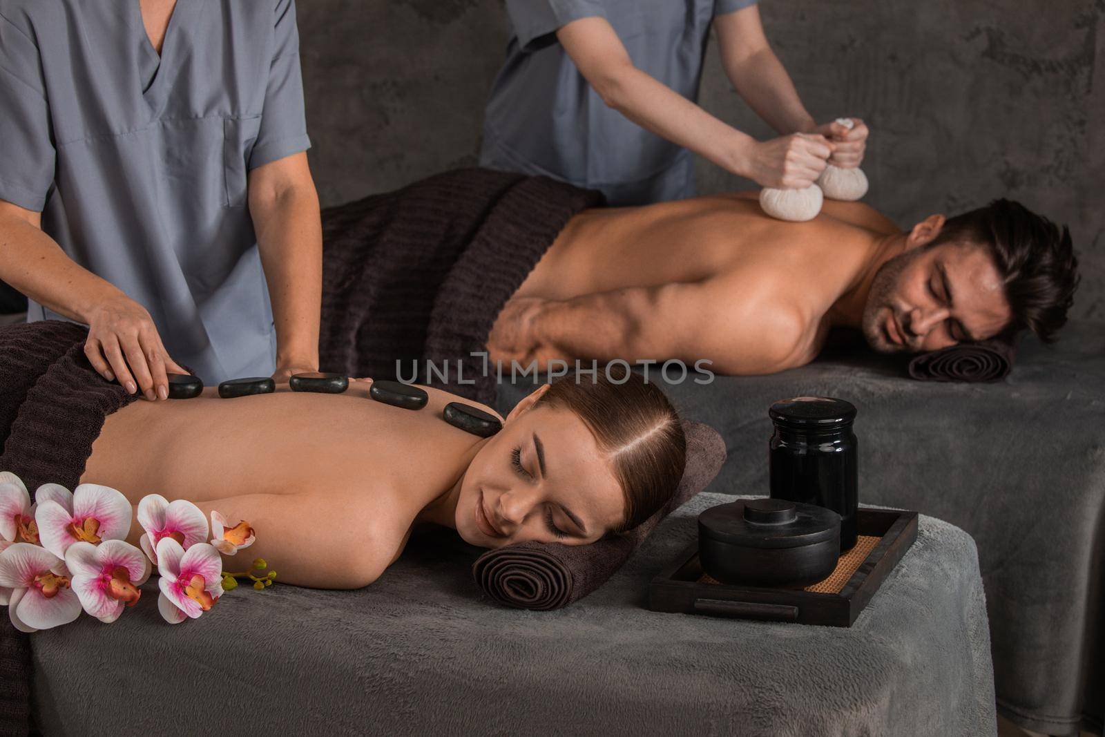 Beautiful couple enjoying massage by ALotOfPeople