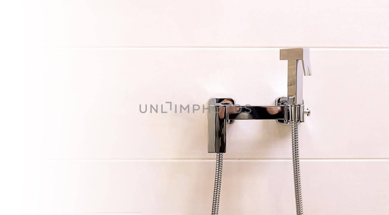 home chrome shower bidet for the bathroom, close-up. Copy paste white background for your design. Modern apartment style, European style
