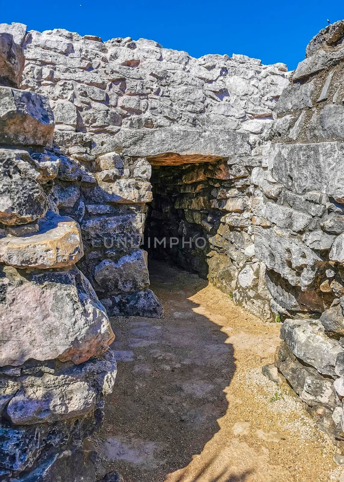 Ancient Tulum ruins Mayan site temple pyramids artifacts seascape Mexico. by Arkadij