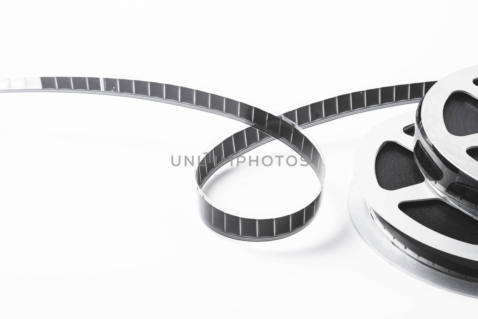 Vintage film strip isolated on white background. Film footage on film. Analog cinema. Old cinema.