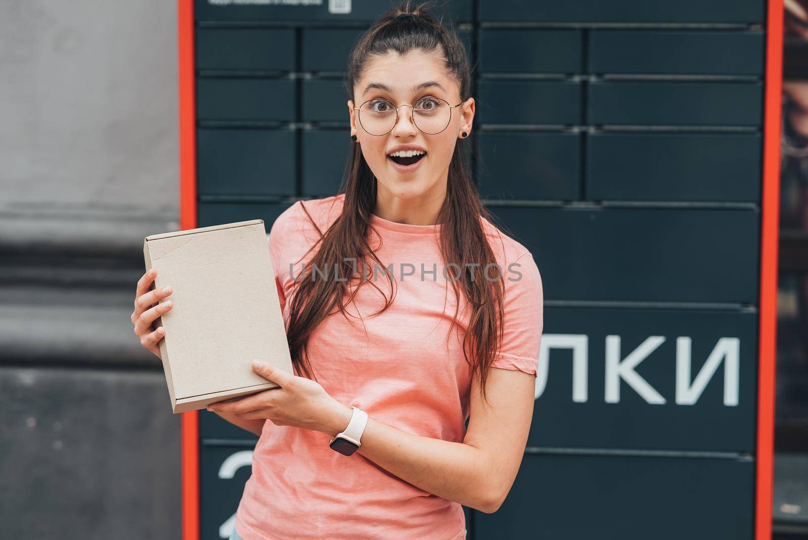 Young woman preparing parcel for shipment to client