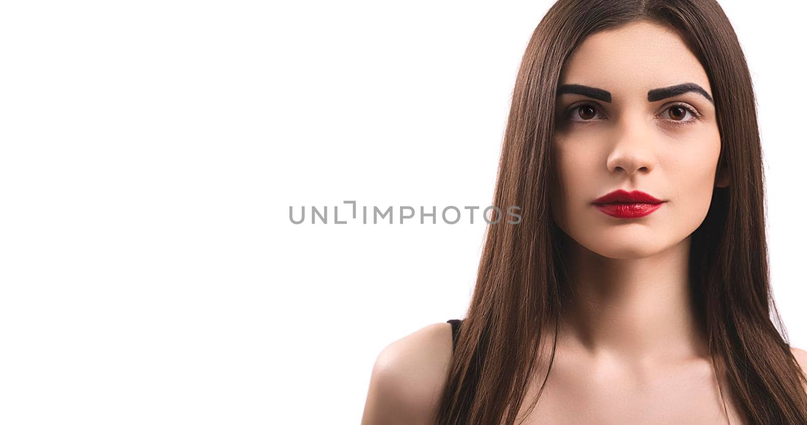 Portrait of nice young gorgeous woman on white backgrounds. To a lots of copy space.
