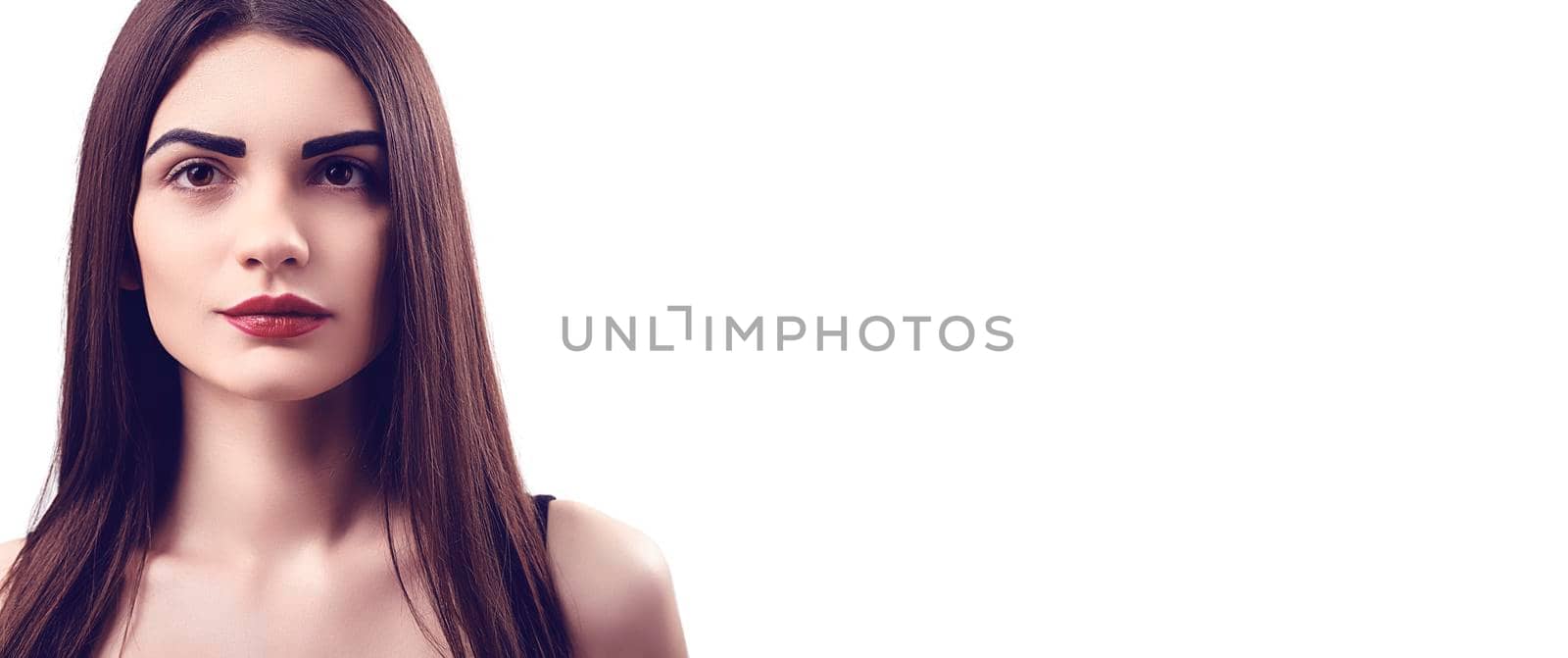 Portrait of nice young gorgeous woman on white backgrounds. To a lots of copy space.