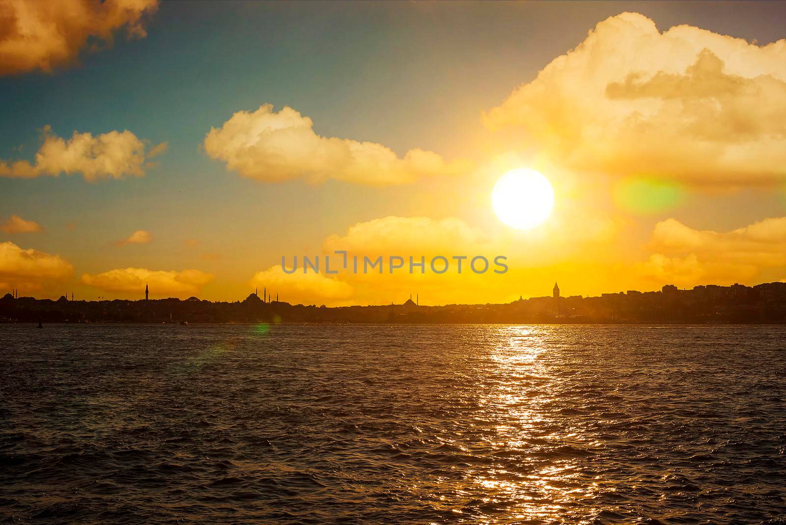 Sunset over Istanbul Silhouette and the fishing boat.