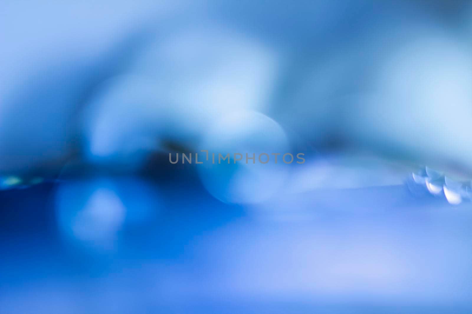 Blue bokeh. Abstract background. Defocused lights.