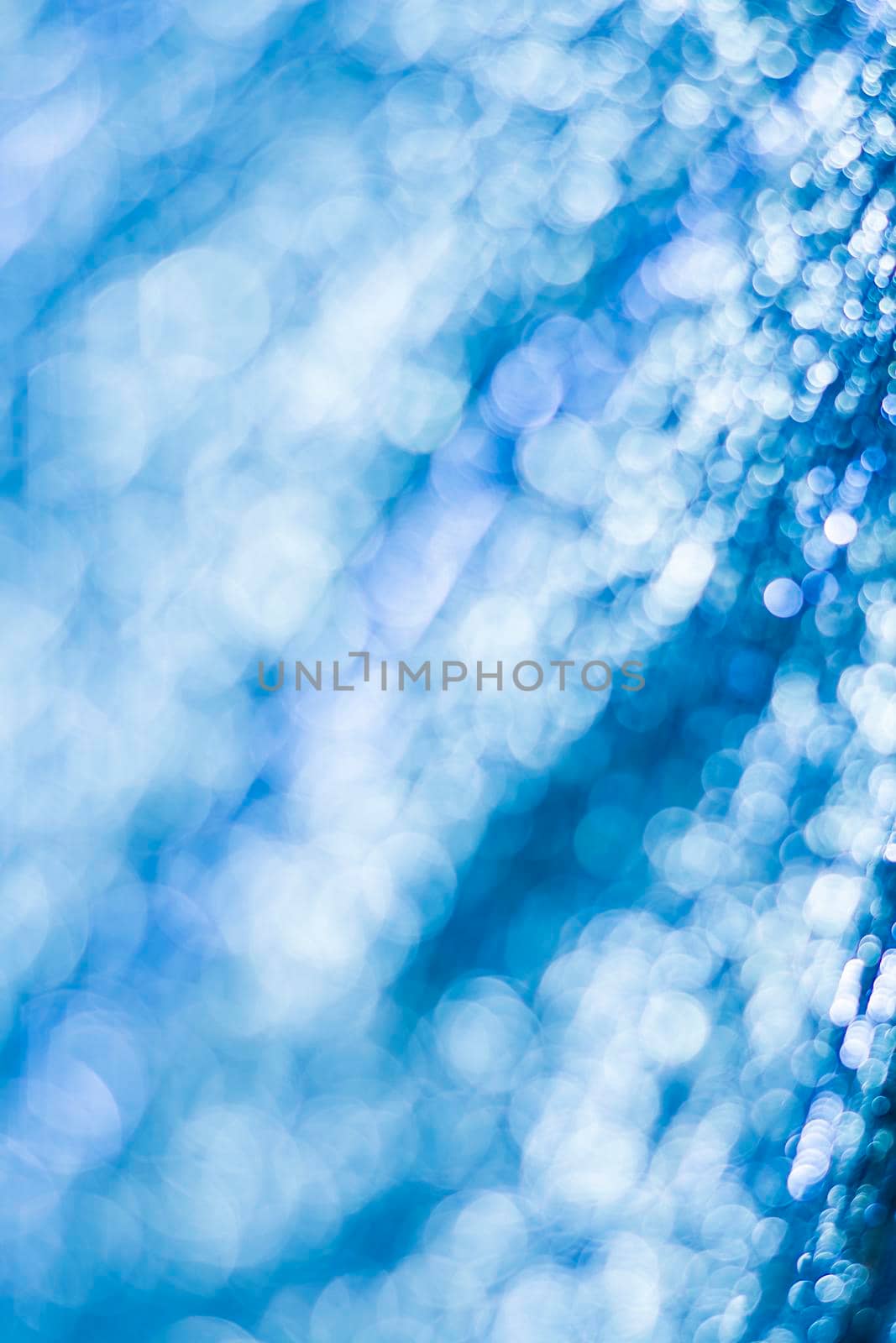 Blue bokeh. Abstract background. Defocused lights.