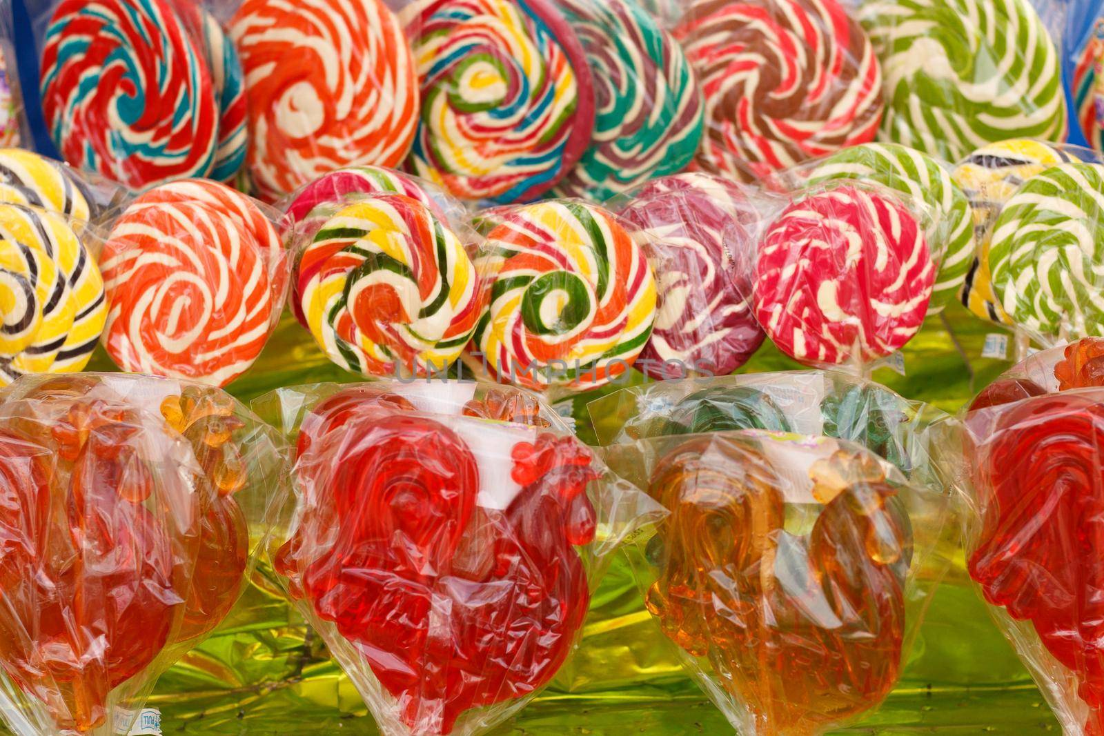 Colorful lollipops in a package. Lots of lollipops on the counter.Selective focus