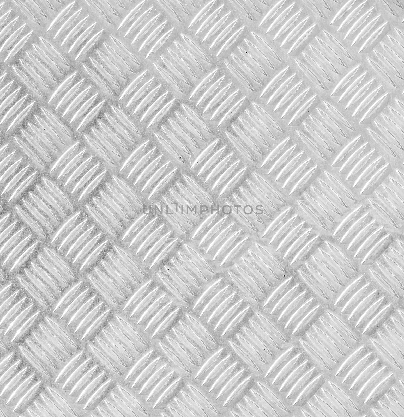 Metal floor plate with diamond pattern.