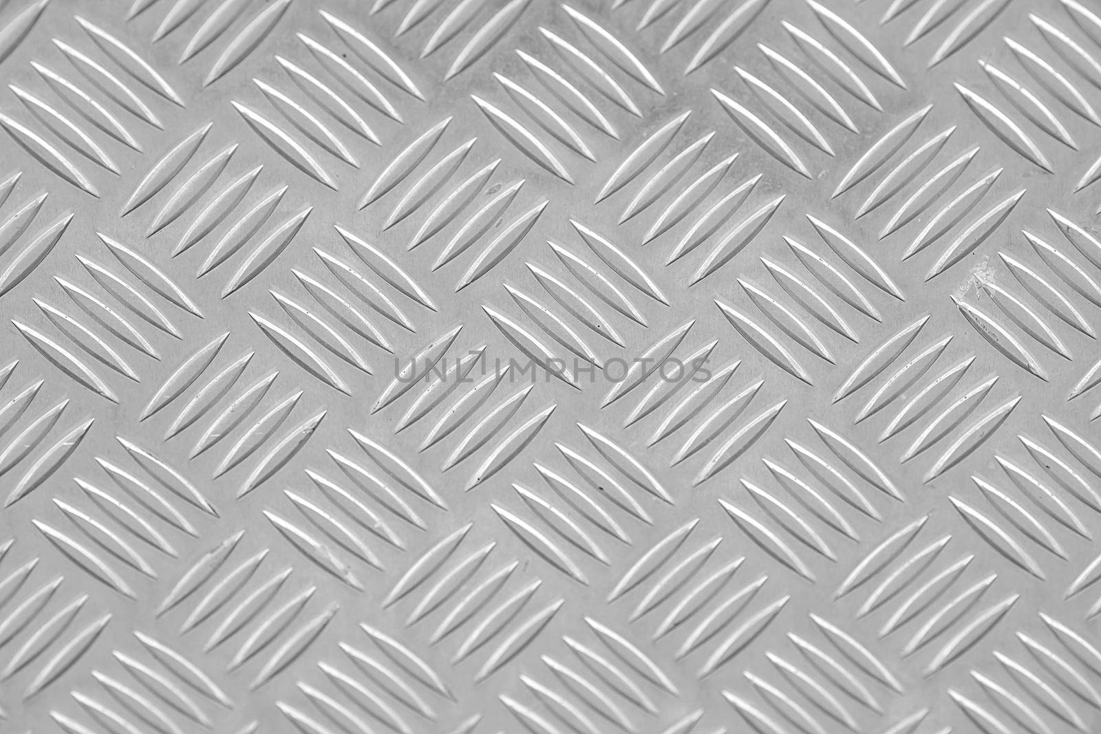 Metal floor plate with diamond pattern.