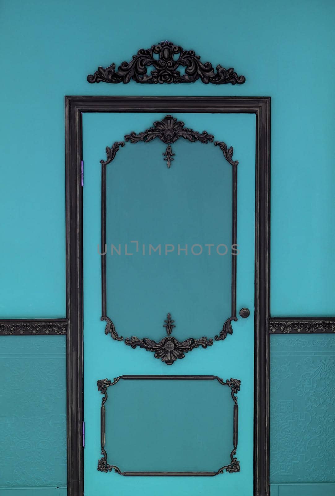 Old dramatic blue doors on the background of the wall.