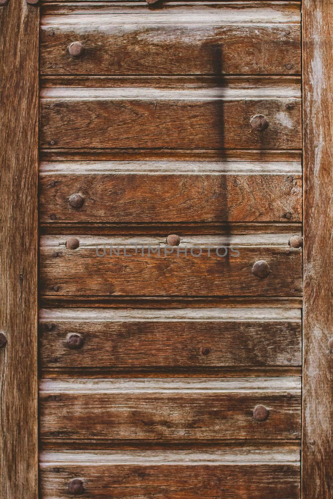 The old wooden door in the old courtyard of the city.