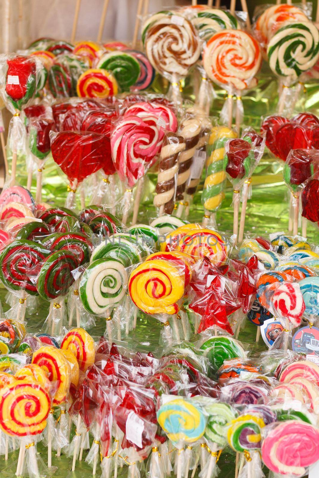 Colorful lollipops in a package. Lots of lollipops on the counter.Selective focus