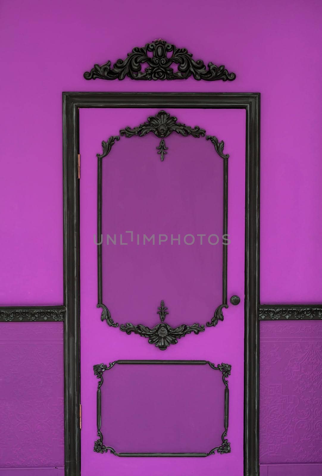 Old dramatic pink doors on the background of the wall.