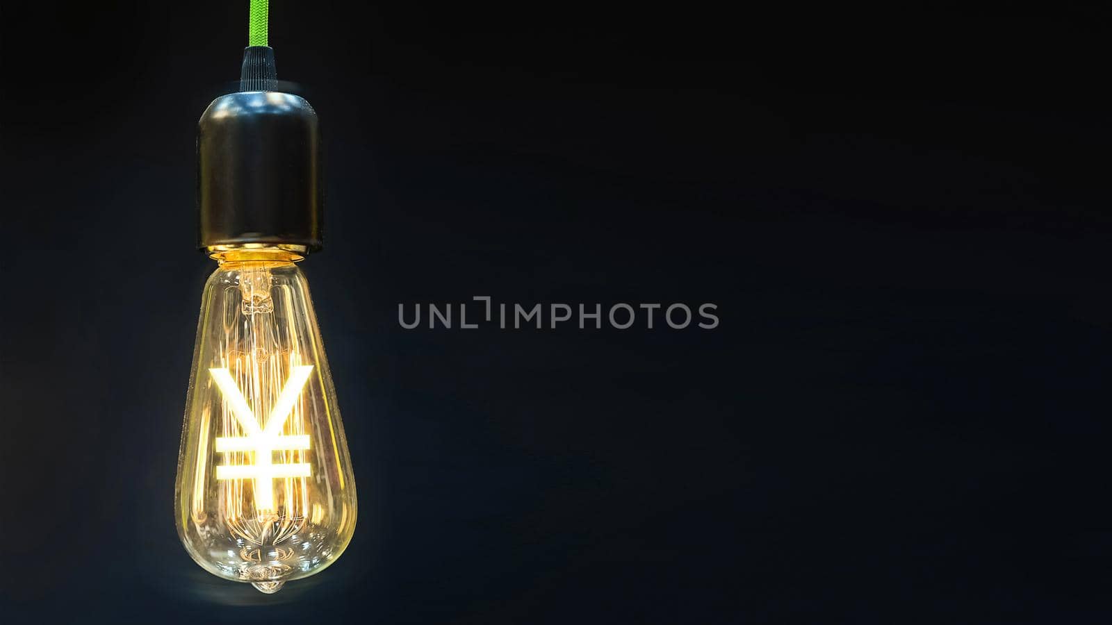 Money making idea. Light bulb with Japanese  Yen symbol.