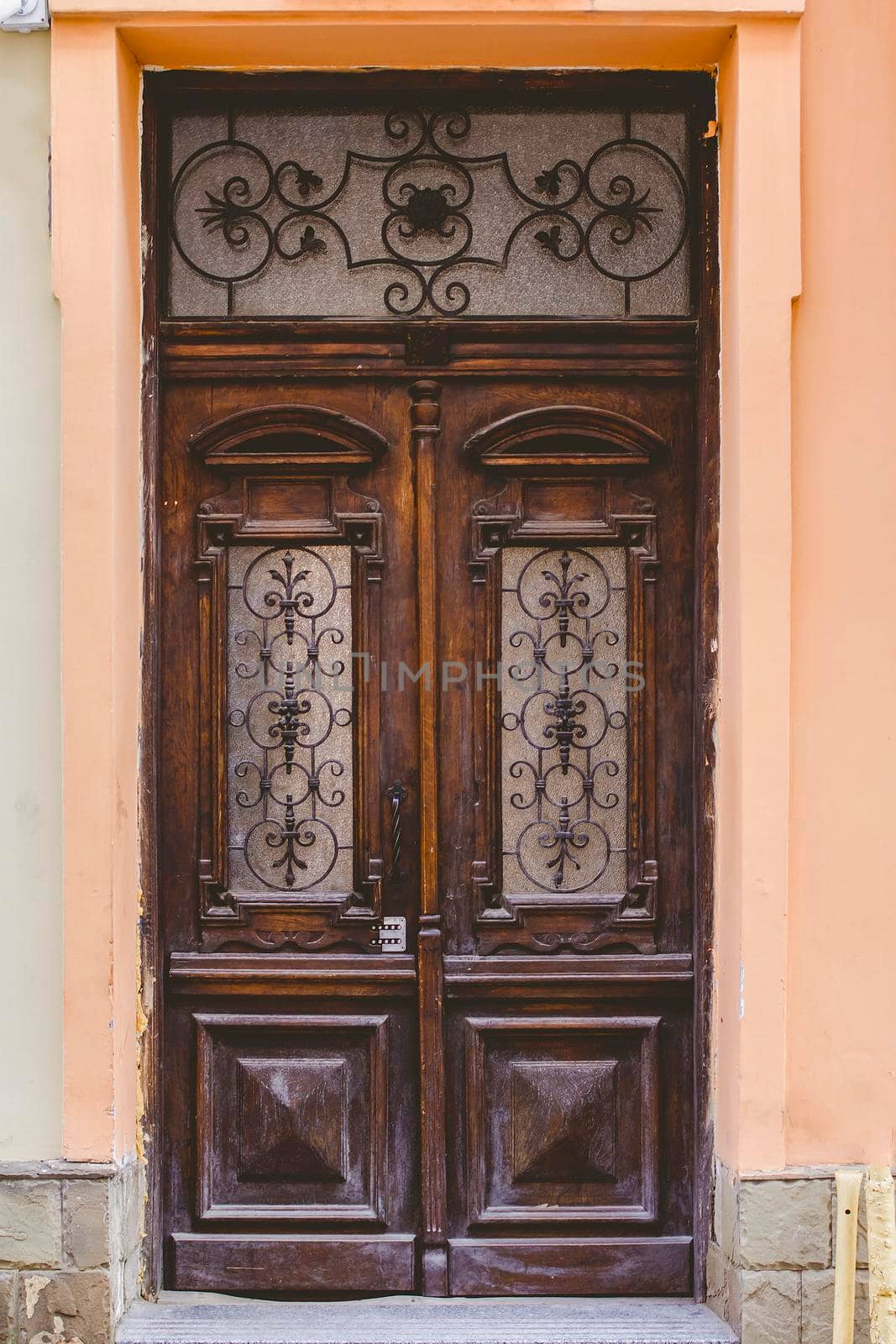 The old wooden door in the old courtyard of the city.