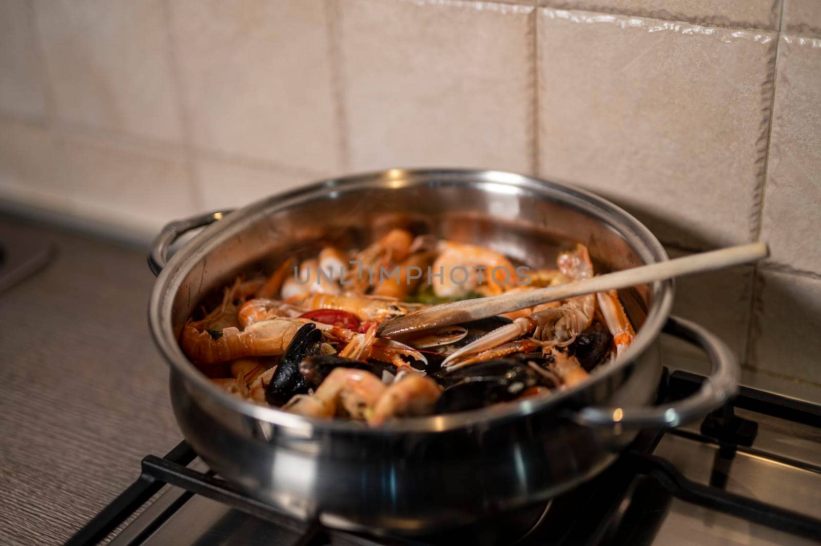 fish soup in the pan with wood mixture by carfedeph