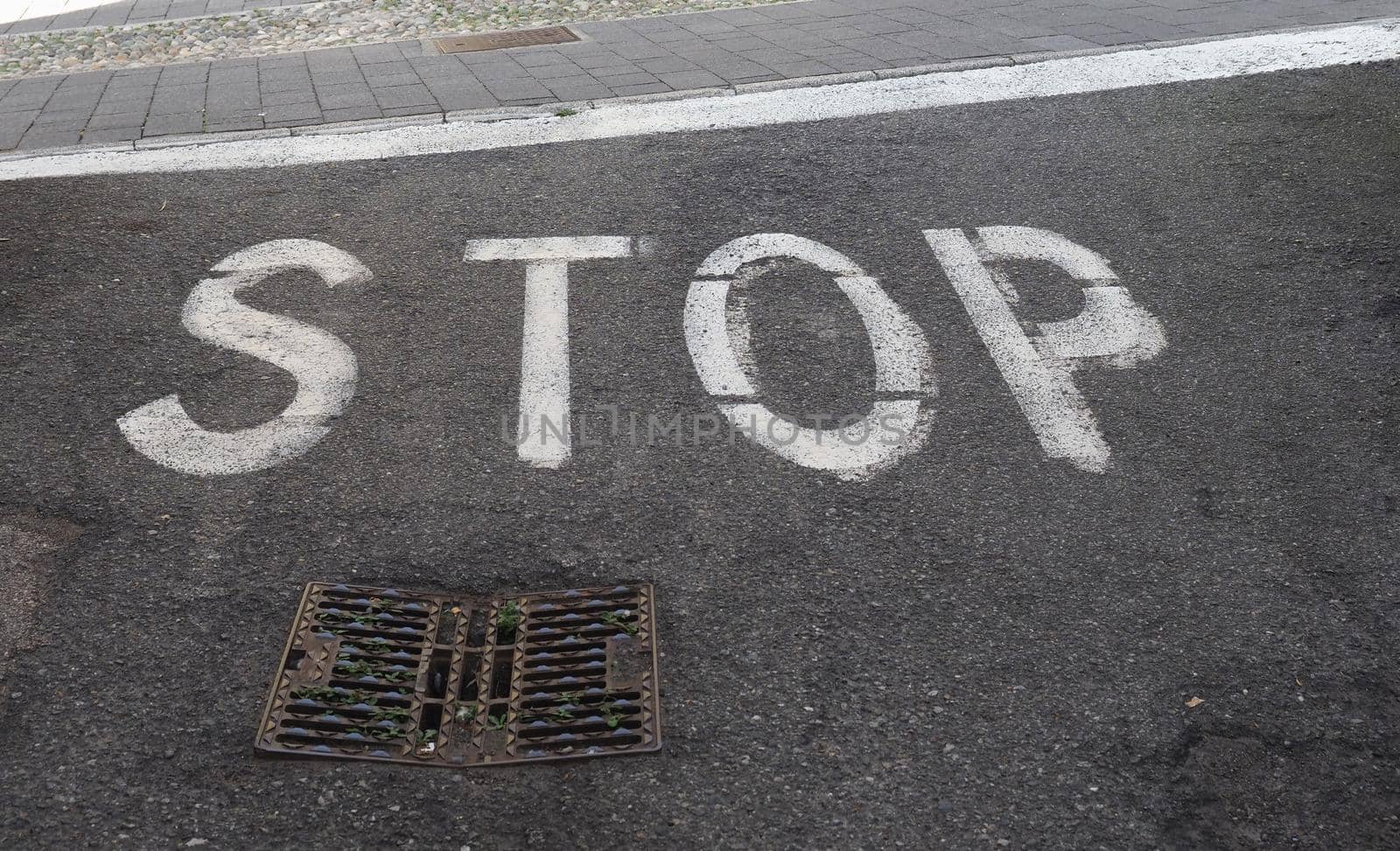 stop sign on tarmac by claudiodivizia