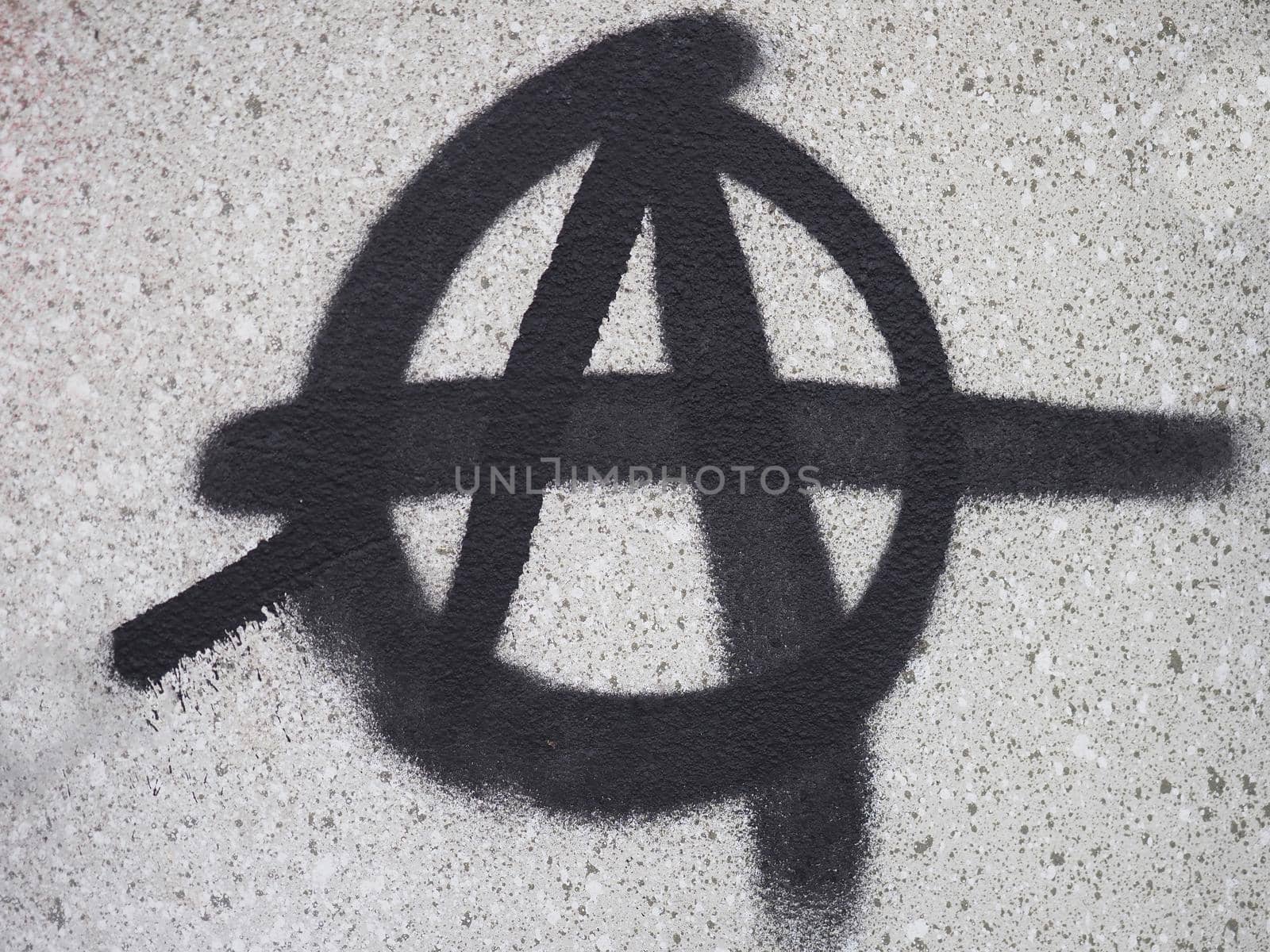 Anarchy symbol on a wall by claudiodivizia