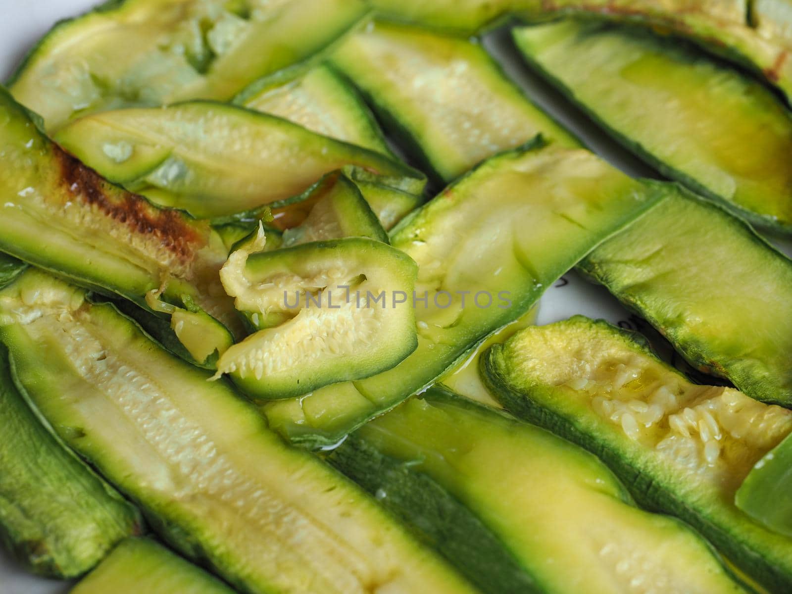 zucchini aka courgettes vegetables food background by claudiodivizia