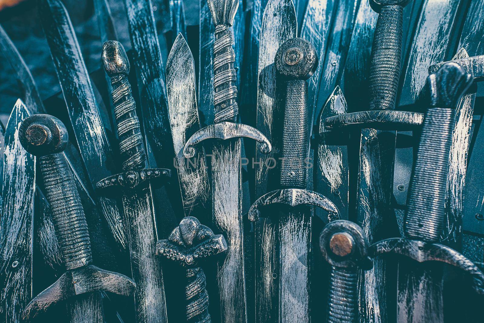 Metal knight swords background. Close up