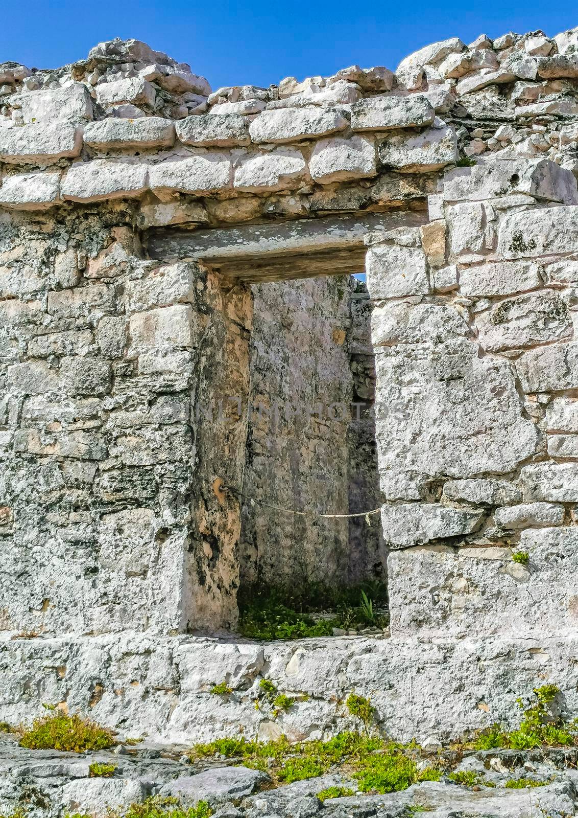 Ancient Tulum ruins Mayan site temple pyramids artifacts seascape Mexico. by Arkadij