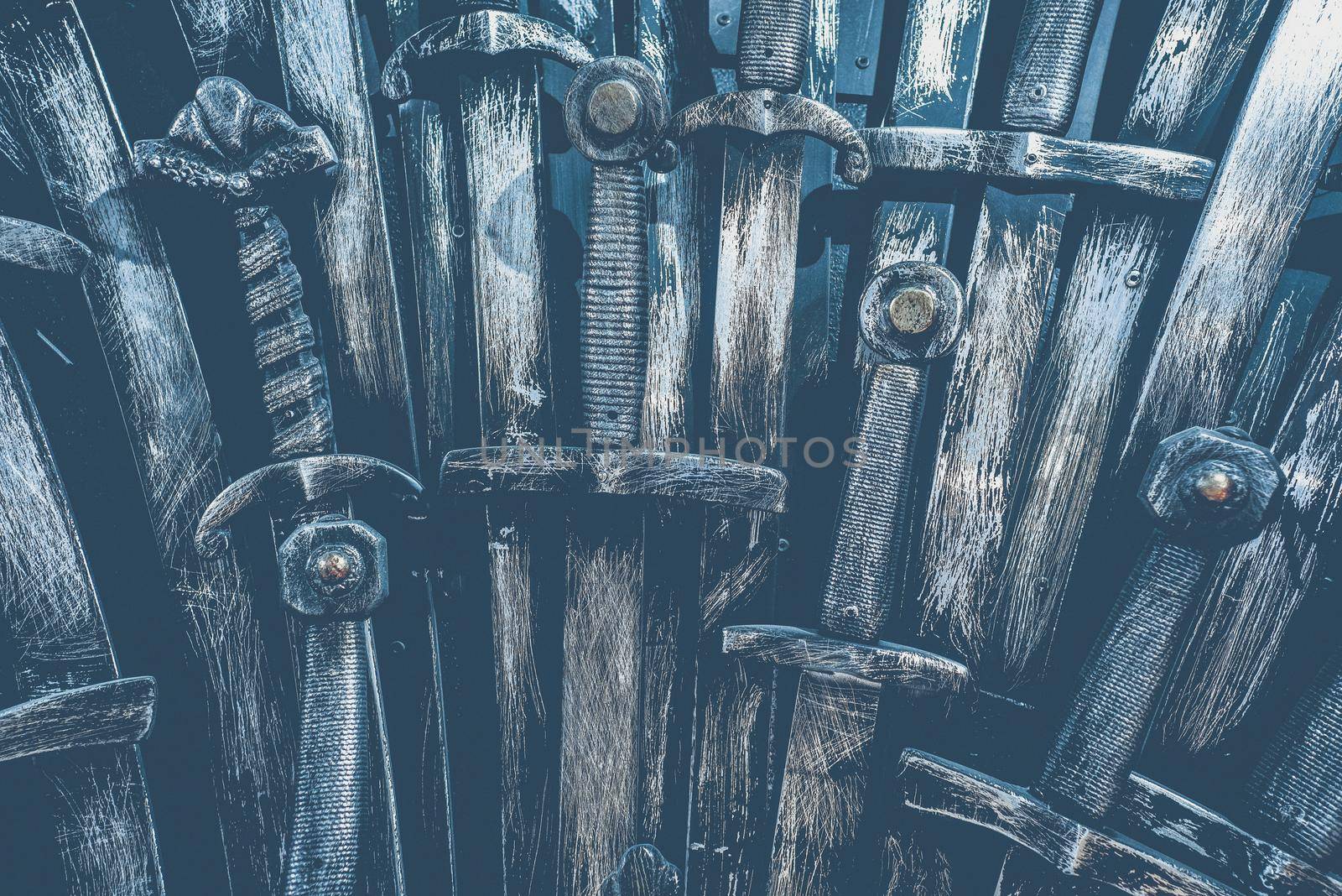 Metal knight swords background. Close up